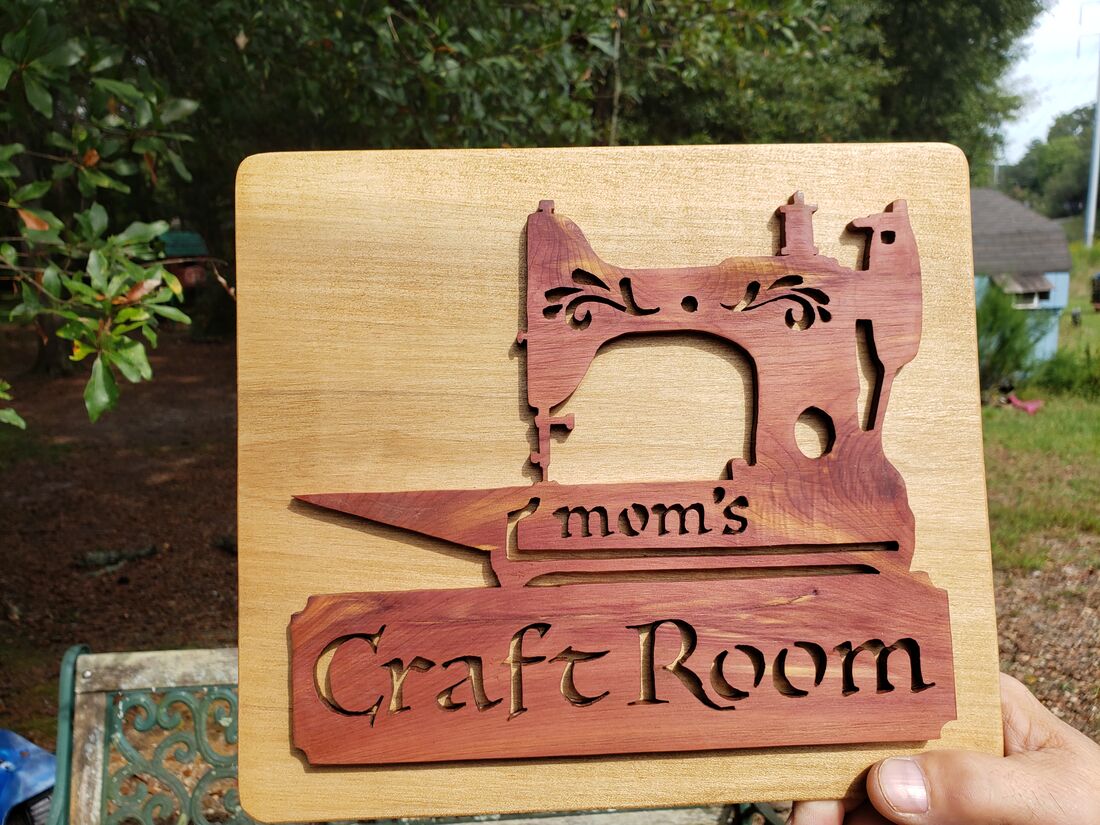 Craft Room sign with a sewing machine cutout