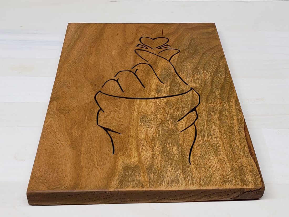 Hand making a finger heart, line art in a warm wood panel